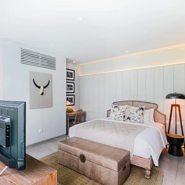 Bedroom with a king bed and a TV cabinet