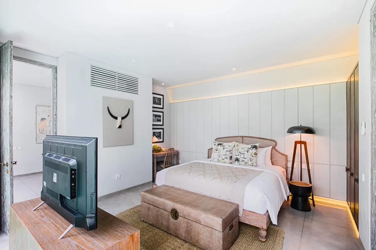 Bedroom with a king bed and a TV cabinet