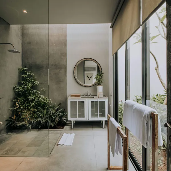 Rain shower next to a planted garden wall