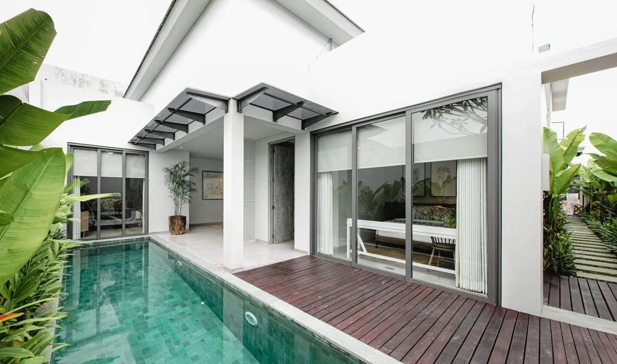 Private pool with a timber deck along the villa