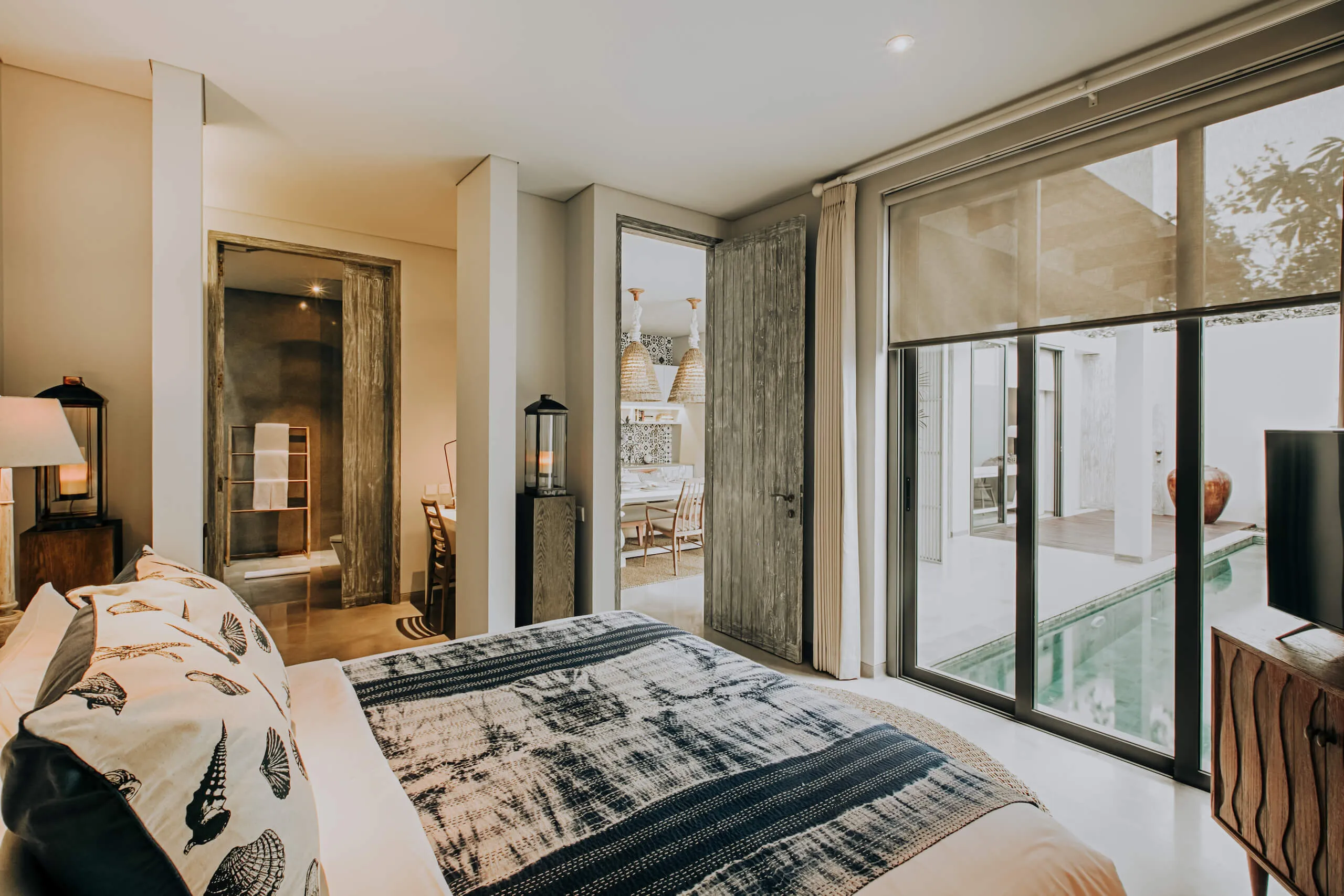 Villa bedroom with a view of the pool