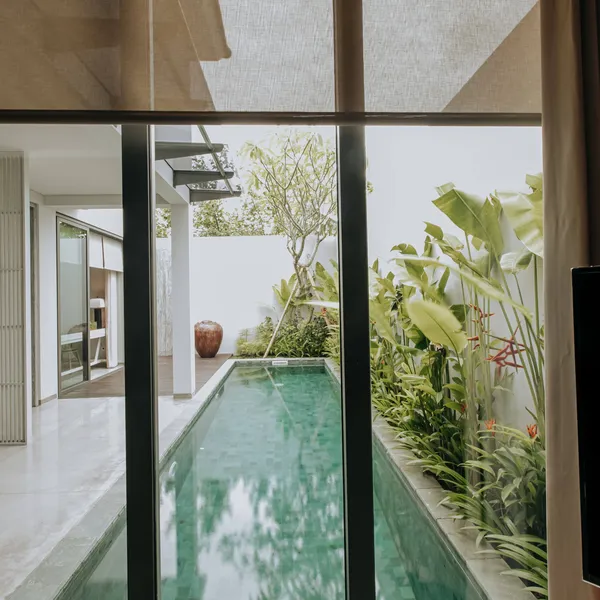 Lap pool beside glass sliding doors