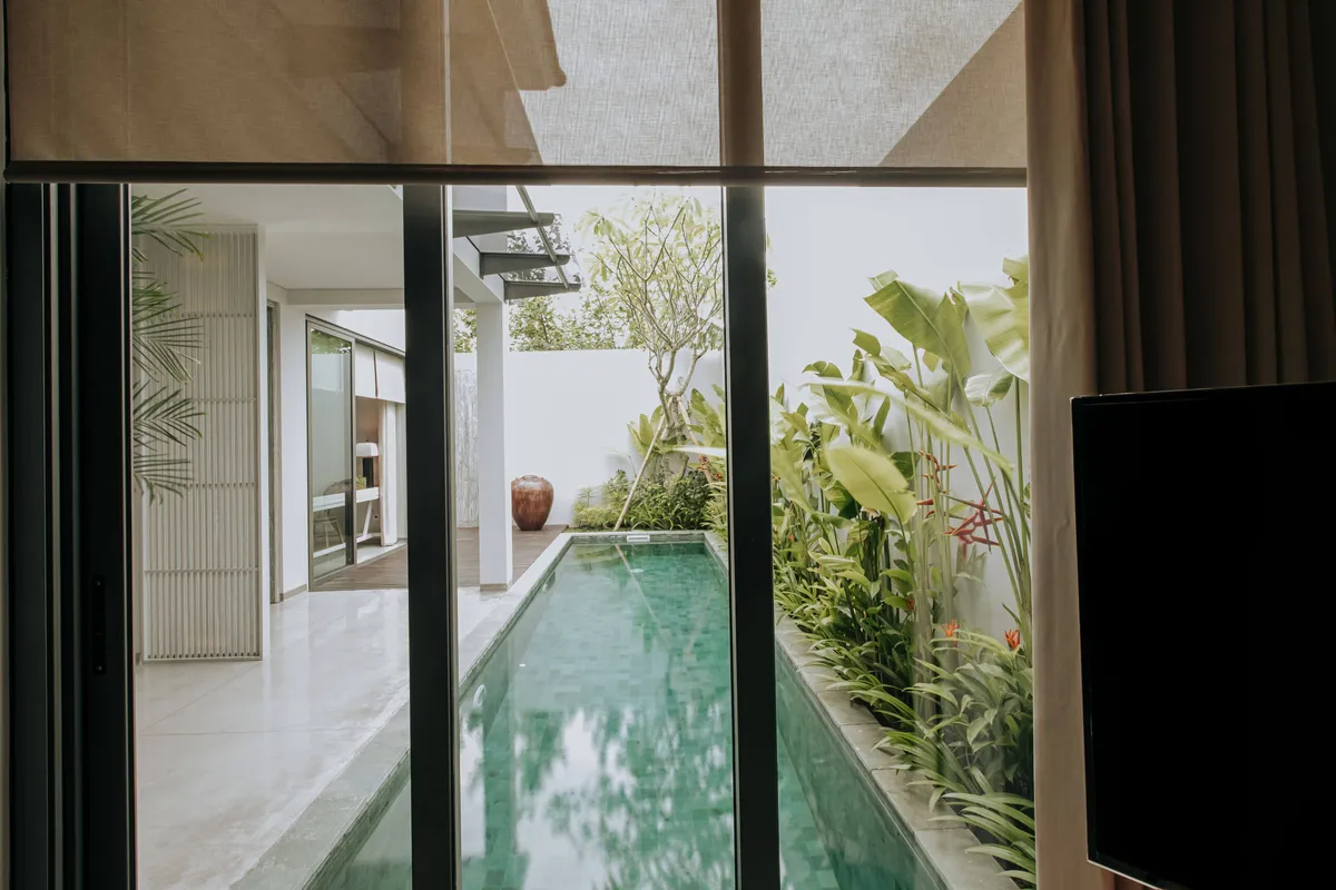 Lap pool beside glass sliding doors